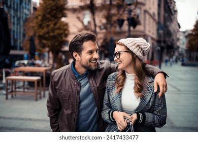 Happy Couple Shopping and Walking in the City - Powered by Shutterstock