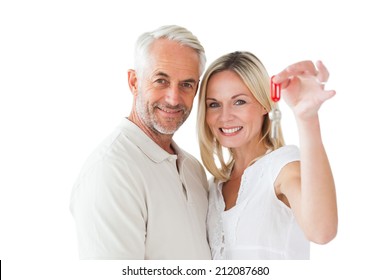 Happy Couple Showing Their New House Key On White Background