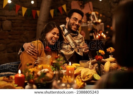 Happy couple sitting at festive table