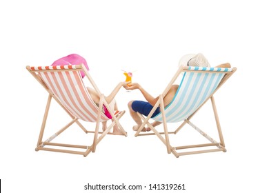 Happy Couple Sitting On  Beach Chairs And Holding Orange Juice