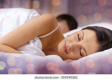 Happy Couple Sleeping In Bed
