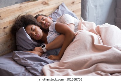 Happy couple sleeping together