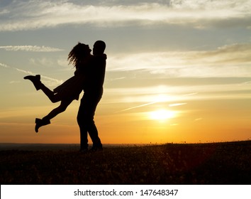 Happy Couple At Sunset