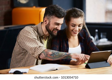 Happy Couple With Tablet And Smiling, Online Shopping, Free Lance Concept, Relationships.