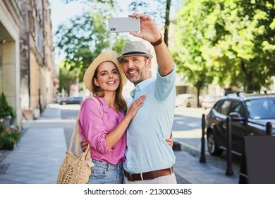 Happy couple taking selfie on city street in summer - Powered by Shutterstock