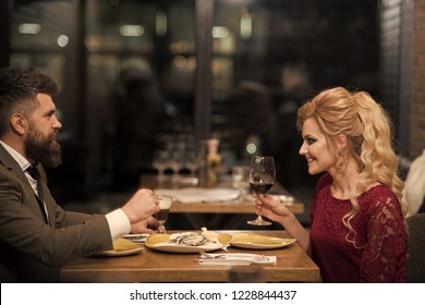 Happy Couple Talking At Cafe, Eating Oysters.