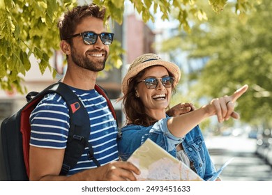 Happy couple, travel and city sightseeing in outdoor, map and urban vacation in Netherlands. People, pointing and explore town for adventure, sunglasses and search for direction or navigation