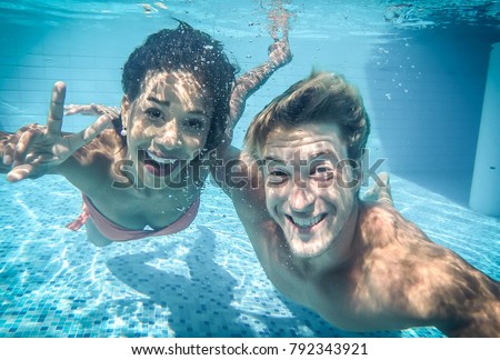 happy couple underwater