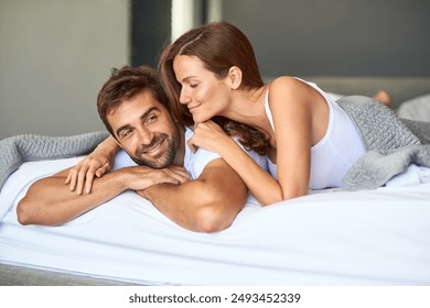 Happy couple, wake up and resting in bedroom, house or support for marriage commitment in morning. Love, comfort or people bonding with smile for romantic relationship, peace or anniversary together - Powered by Shutterstock