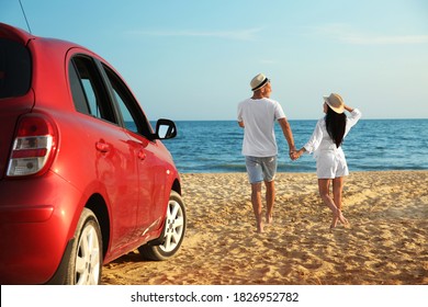 Happy Couple Walking On Sandy Beach, Back View. Summer Trip