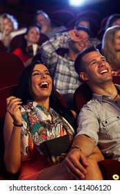 Happy Couple Watching Comedy In Movie Theater, Laughing.