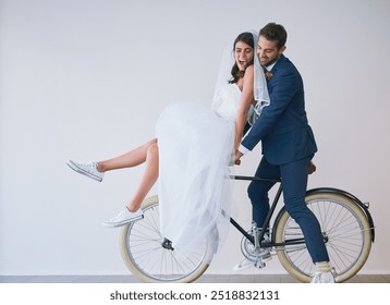 Happy couple, wedding bride and groom on bicycle for travel, laughing or love. Newlyweds, man and woman on bike for marriage, cycling or celebrate romantic honeymoon together on white wall background - Powered by Shutterstock