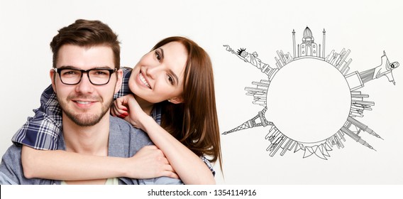 Happy Couple At White Backround With Drawn Circle From World Sights Simbols, Copy Space. Love And Travel Concept