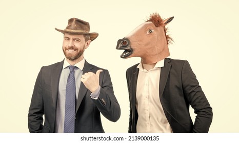 Happy Cowboy Man Point Finger At Businessman Wearing Horse Head. Western Party. Cowboy Party