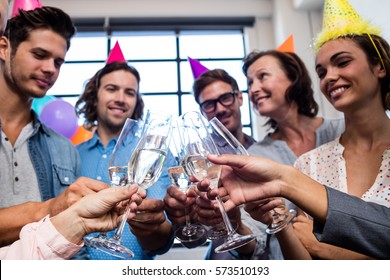 Happy coworker drinking champagne to celebrate a birthday in the office - Powered by Shutterstock