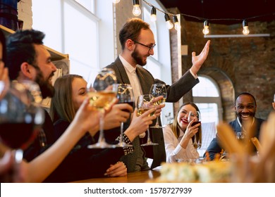 Happy Co-workers Celebrating While Company Party And Corporate Event. Young Caucasian People In Business Attire Cheering, Laughting. Concept Of Office Culture, Teamwork, Friendship, Holidays, Weekend.