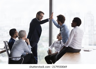 Happy Coworkers Clapping Hands At Team Meeting, Celebrating Group Success. Business Project Leader, Boss Giving Praise, Recognition, High Five To Best Employee, Expressing Respect, Gratitude