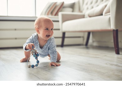 Happy crawling baby explores living room with colorful toy on a bright and sunny day - Powered by Shutterstock