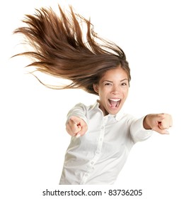 Happy Crazy Excited Woman Screaming And Pointing At Camera With Wild Long Hair In The Wind. Beautiful Ecstatic Mixed Race Caucasian Asian Female Model.