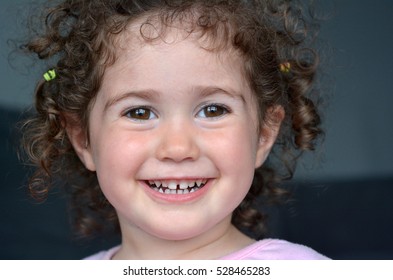 Happy Curly Smiley Child (girl Age 02).Childhood Concept. Real People. Copy Space