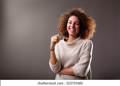 Happy Curly South-american Woman Laughing