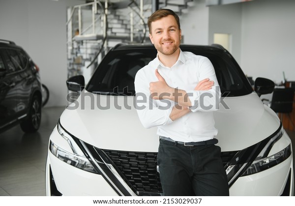 Happy\
customer just bought a car at car\
dealership.