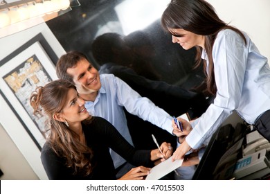 Happy Custumers Paying At The Hotel With A Credit Card