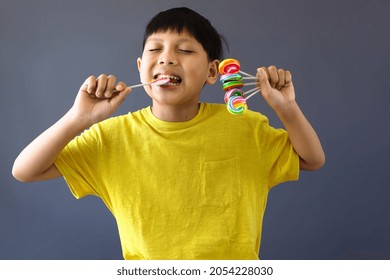 Happy Cute Boy Bite Lollipop Candy 