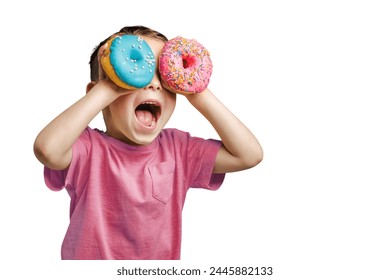 a Happy cute boy is having fun played with donuts Bright photo of a child. Colored donuts - Powered by Shutterstock