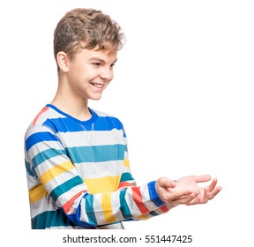 Happy Cute Child Reaching Out His Palms And Catching Something. Half-length Emotional Portrait Of Caucasian Teen Boy, Laughing. Funny Teenager Trying To Catch Something, Isolated On White Background.