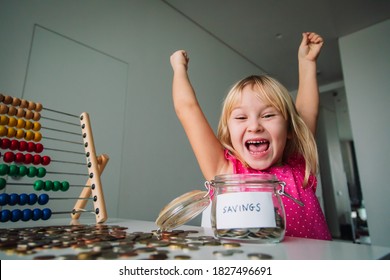 Happy Cute Girl Saving Money, Kid Counting Coins