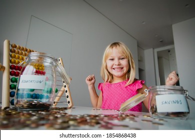 Happy Cute Girl Saving Money, Kid Counting Coins