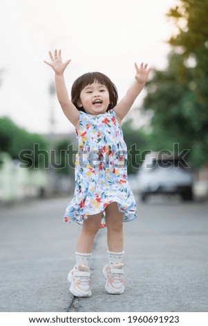 Similar – Image, Stock Photo A baby girl is spoon fed with yogurt by her mother