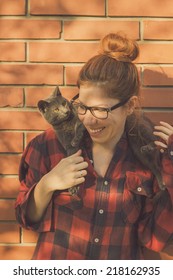 Happy Cute Hipster Girl Being Silly And Playing With Her Russian Blue Cat