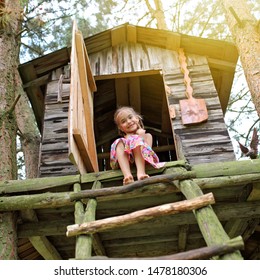 Happy Cute Kid Playing In The Treehouse In Summer, Happy Summertime In Countryside, Ecological Playground 