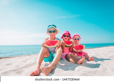 Happy Cute Kids Eating Watermelon At Beach