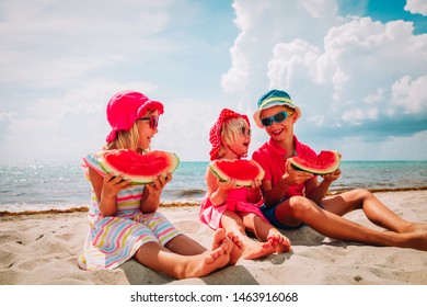 Happy Cute Kids Eating Watermelon At Beach