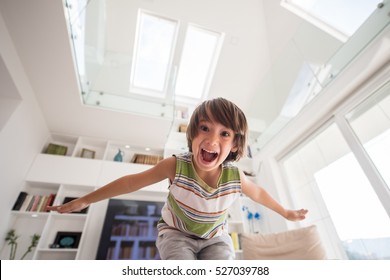 Happy Cute Little Boy At New Modern Home