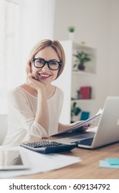 Happy Cute Pretty Accountant Working With Computer And Calculator.