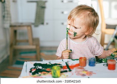 Happy Cute Toddler Painting With Gouache Paints