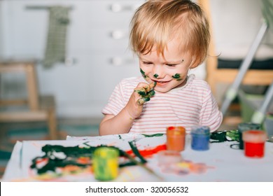 Happy Cute Toddler Painting With Gouache Paints