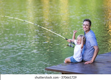 Happy Dad And Son Fishing