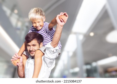 Happy Daddy Holding Kid In Arms, Hugging Toddler. Enjoying Being Father, Spending Time And Playing With Cute Preschooler Son, Talking To Child, Laughing. Parent Concept