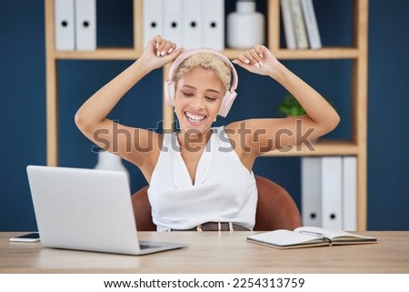 Happy, dance and woman with music from a laptop, listening to the radio and audio in an office. Podcast, playful and dancing employee streaming a sound playlist on a pc with a smile while working