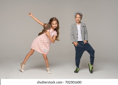 Happy dancing kids. Studio photo.