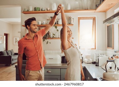 Happy, dancing and loving couple bonding and having fun while spending time together at home. Energetic, fun and active couple sharing a dance and romantic moment while enjoying their anniversary - Powered by Shutterstock