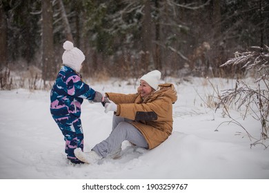 Happy daughter and mother sledging together in winter park