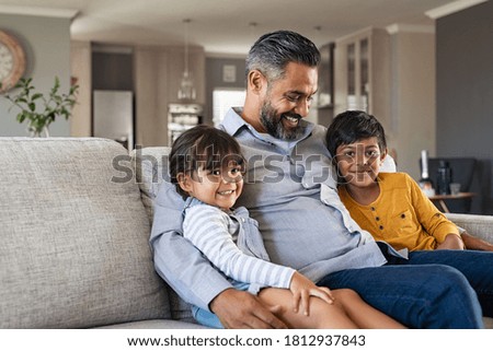 Similar – Two kids sitting on a bench and admiring the scenery