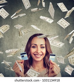 Happy Debt Free Woman Holding A Credit Card Cut In Two Pieces Under Money Rain  