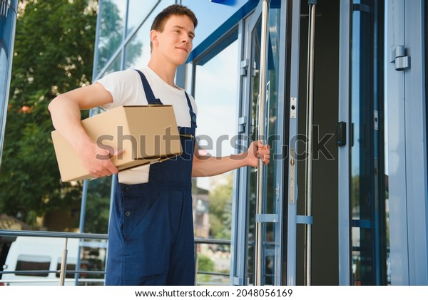 happy delivery man with\
box